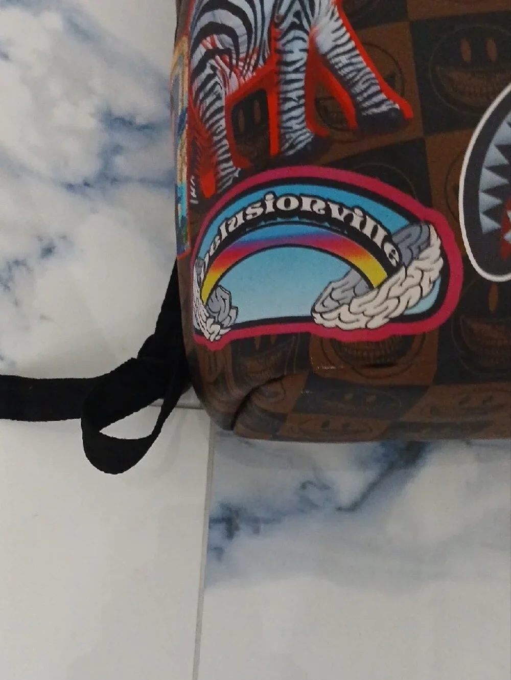 Sprayground Brown Checkerboard Backpack with Multicolor Sticker Graphics